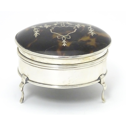 402 - A silver ring box raised on three feet, the tortoiseshell lid with piquework decoration, hallmarked ... 