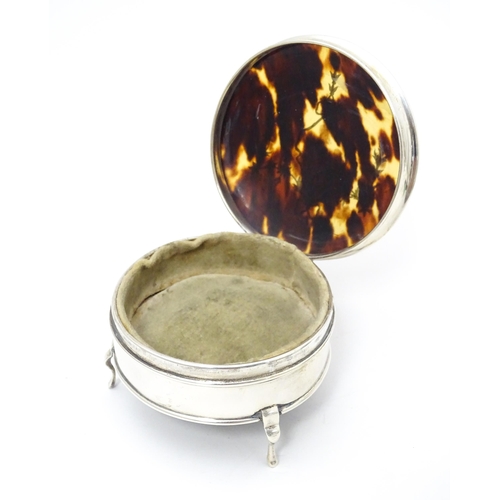 402 - A silver ring box raised on three feet, the tortoiseshell lid with piquework decoration, hallmarked ... 