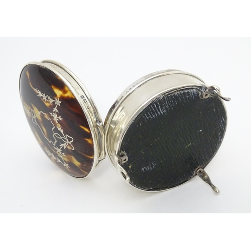 402 - A silver ring box raised on three feet, the tortoiseshell lid with piquework decoration, hallmarked ... 