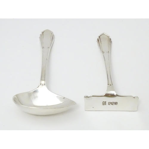 425 - An Art Deco child's silver spoon and pusher hallmarked Sheffield 1936, maker Joseph Elliot & Sons. C... 