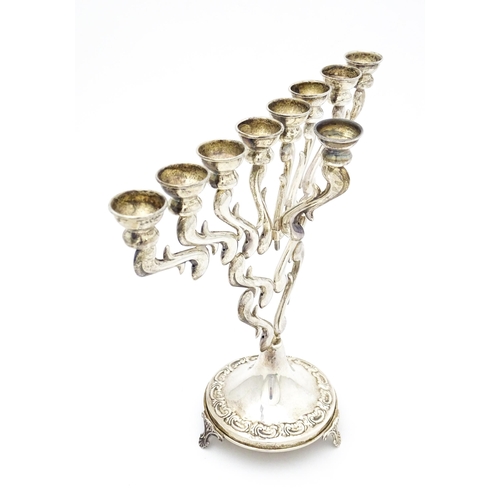 430 - Judaica : A sterling silver Hanukkah Menorah candelabra with 9 branches, marked sterling and .925. A... 