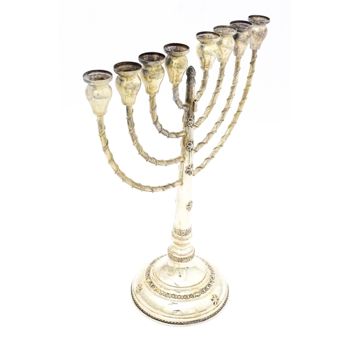 431 - Judaica : A .925 silver Hanukkah Menorah candelabra with 8 branches. Approx. 13