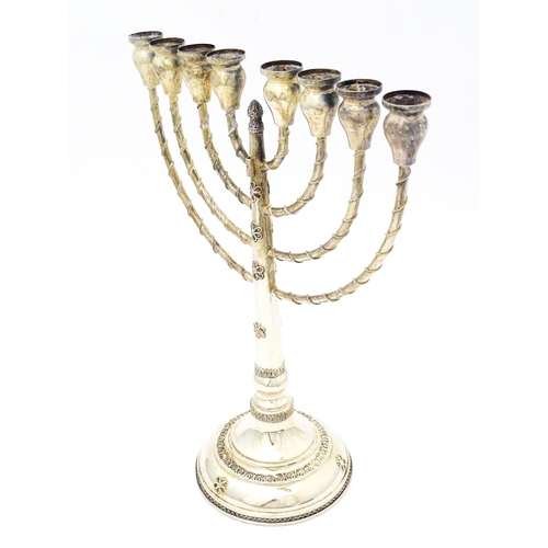 431 - Judaica : A .925 silver Hanukkah Menorah candelabra with 8 branches. Approx. 13