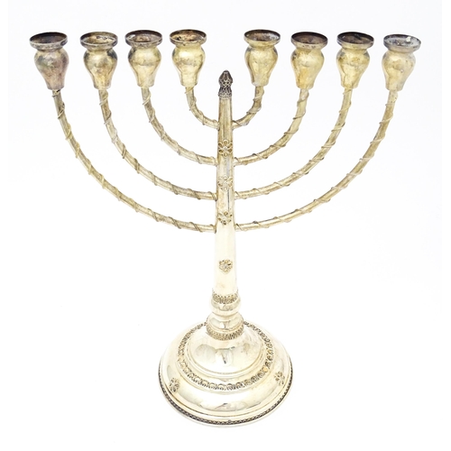 431 - Judaica : A .925 silver Hanukkah Menorah candelabra with 8 branches. Approx. 13