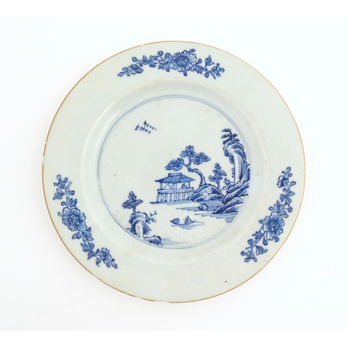 45 - Three Chinese plates / dishes comprising a blue and white example decorated with flowers, foliage, b... 