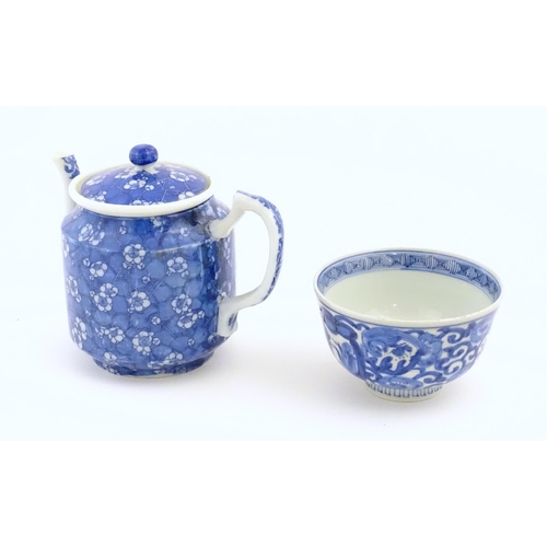 56 - A Chinese blue and white teapot decorated with prunus blossom. Together with a Chinese blue and whit... 