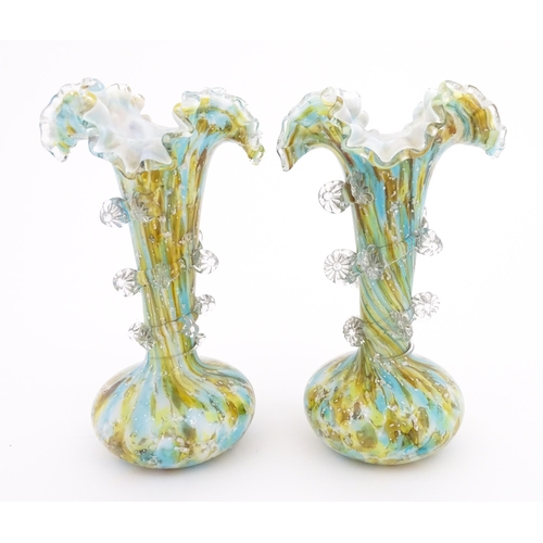 186 - A pair of art glass vases with flared rims and prunt detail. Approx 9 1/2