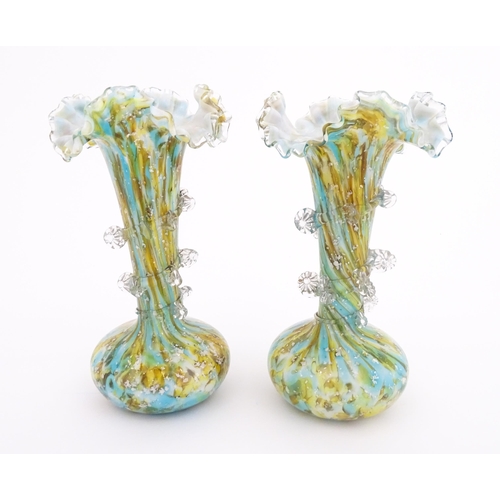 186 - A pair of art glass vases with flared rims and prunt detail. Approx 9 1/2