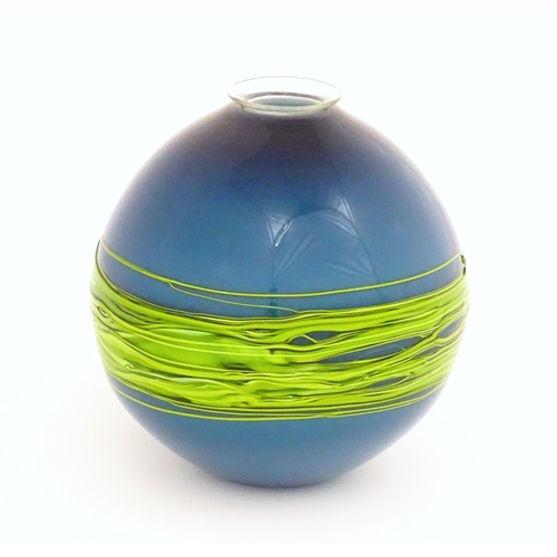 187 - An art / studio glass vase by Bob Crooks of globular form trailed with green banding over a blue gro... 