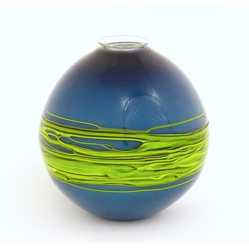 187 - An art / studio glass vase by Bob Crooks of globular form trailed with green banding over a blue gro... 