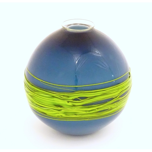 187 - An art / studio glass vase by Bob Crooks of globular form trailed with green banding over a blue gro... 