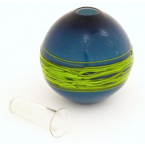 187 - An art / studio glass vase by Bob Crooks of globular form trailed with green banding over a blue gro... 