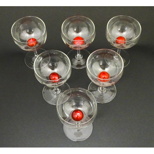 188 - Six 19thC wine glasses, each decorated with cockfighting scenes and cherry detail to the stem top. A... 