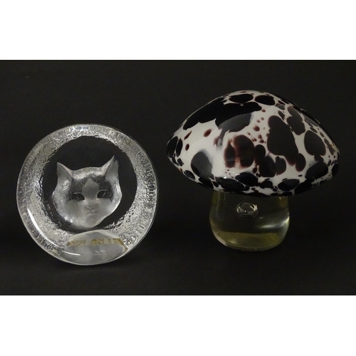 206 - Four 20thC glass paperweights, comprising a Wedgwood owl, two Mats Jonasson cats and a white/purple ... 