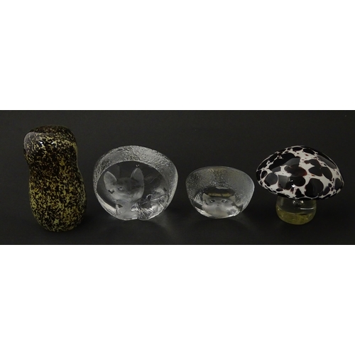 206 - Four 20thC glass paperweights, comprising a Wedgwood owl, two Mats Jonasson cats and a white/purple ... 