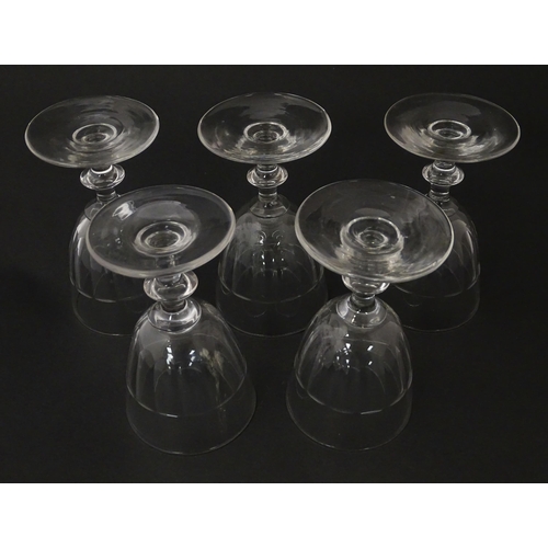 207 - Five cut glass champagne coupes together with five cut glass pedestal wine glasses. Approx 4 1/2