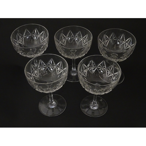 207 - Five cut glass champagne coupes together with five cut glass pedestal wine glasses. Approx 4 1/2