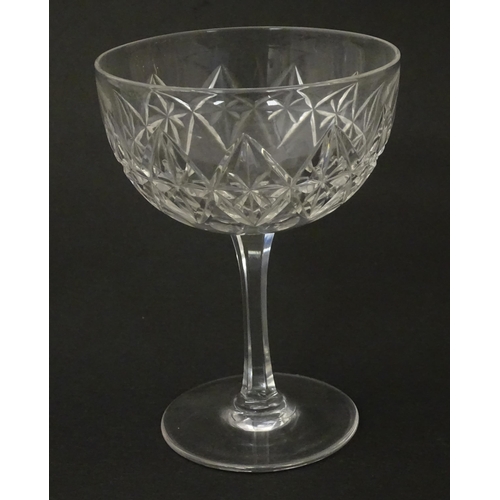 207 - Five cut glass champagne coupes together with five cut glass pedestal wine glasses. Approx 4 1/2