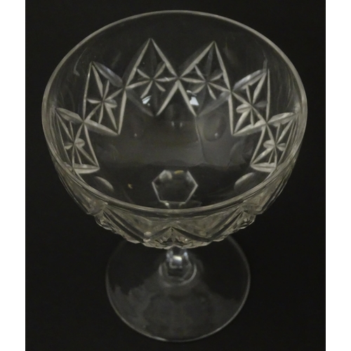 207 - Five cut glass champagne coupes together with five cut glass pedestal wine glasses. Approx 4 1/2