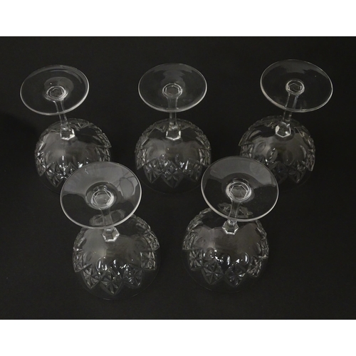 207 - Five cut glass champagne coupes together with five cut glass pedestal wine glasses. Approx 4 1/2