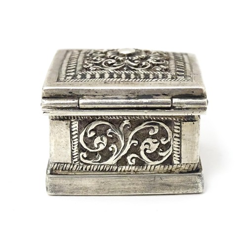 437 - A white metal stamp box with acanthus scroll detail. 1 1/4