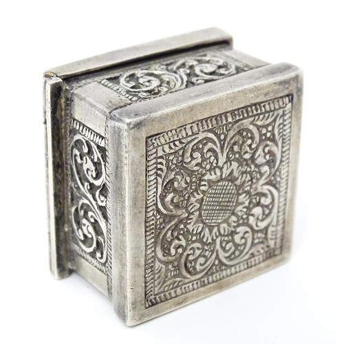 437 - A white metal stamp box with acanthus scroll detail. 1 1/4