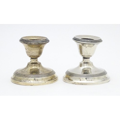 443 - A pair of short silver candlesticks, hallmarked Birmingham 1923. Approx. 2 1/2