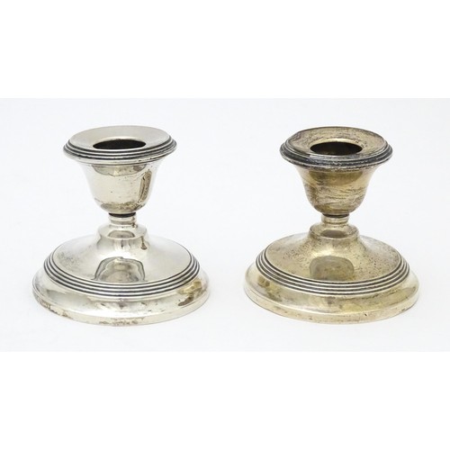 443 - A pair of short silver candlesticks, hallmarked Birmingham 1923. Approx. 2 1/2