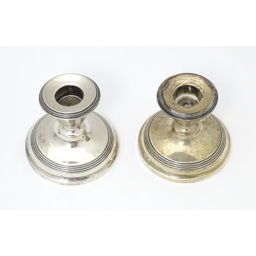 443 - A pair of short silver candlesticks, hallmarked Birmingham 1923. Approx. 2 1/2