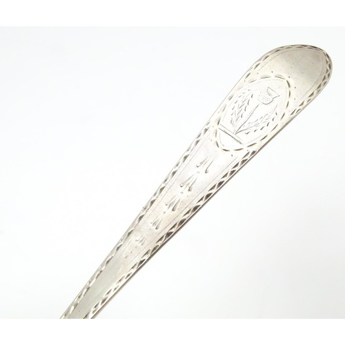 461 - An 18thC Irish silver bright cut spoon, hallmarked Dublin c. 1785, maker Michael Keating. Together w... 