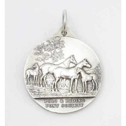 468 - A silver medal / medallion form the Polo & Riding Pony Society, with relief horse detail, bearing th... 