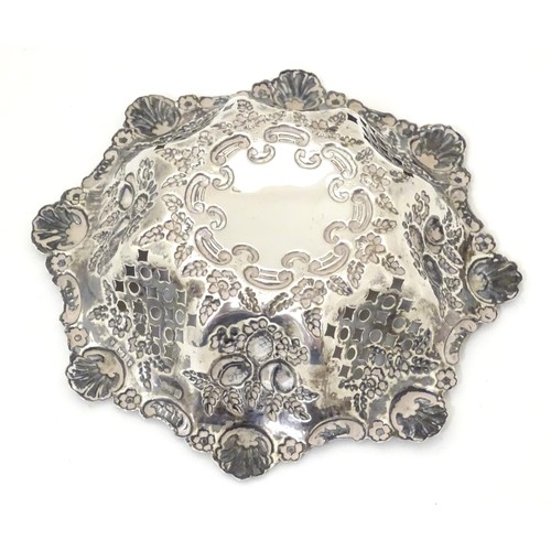 485 - A silver pin dish with pierced and embossed decoration. Hallmarked Birmingham 1900 maker Miller Brot... 