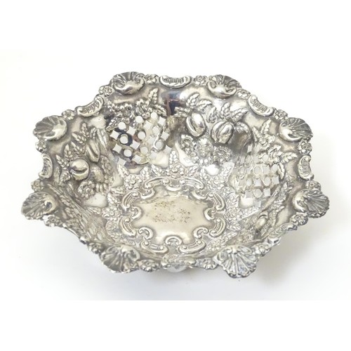 485 - A silver pin dish with pierced and embossed decoration. Hallmarked Birmingham 1900 maker Miller Brot... 