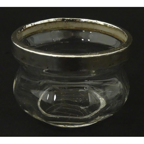 493 - Three items of silver mounted glass ware to include a bowl, salt and scent bottle The tallest Approx... 