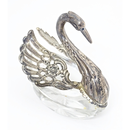 498 - A novelty cut glass salt with silver mounts modelled as a swan, bearing import marked for London 197... 