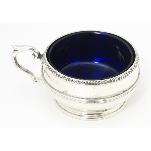 502 - A silver salt with blue glass liner hallmarked Birmingham 1919 maker Collingwood & Sons Ltd.