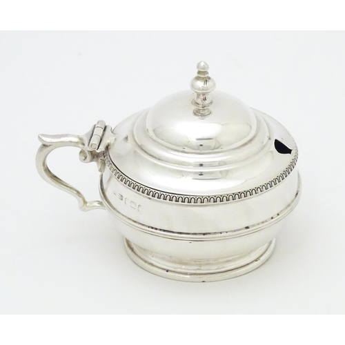 505 - A silver mustard pot with blue glass liner hallmarked Birmingham 1919 maker Collingwood & Sons Ltd. ... 