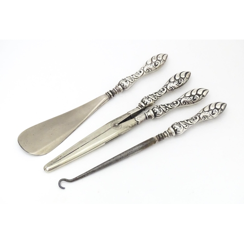 508 - Three silver handled items comprising shoe horn, button hook and glove stretchers. Shoe horn approx.... 