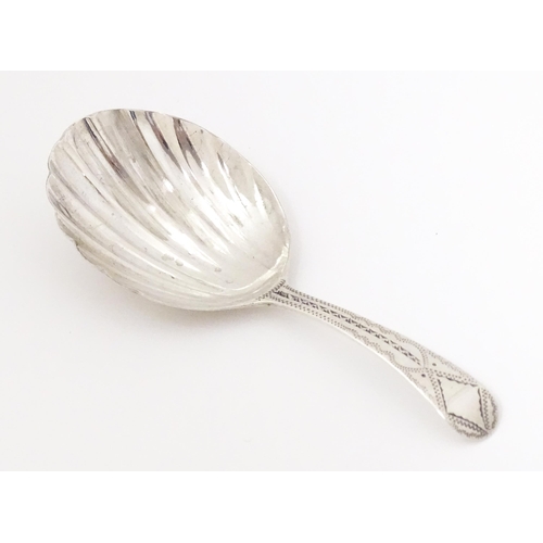 548 - A Geo III silver caddy spoon with shell formed bowl, hallmarked London 1802 maker George Wintle. App... 