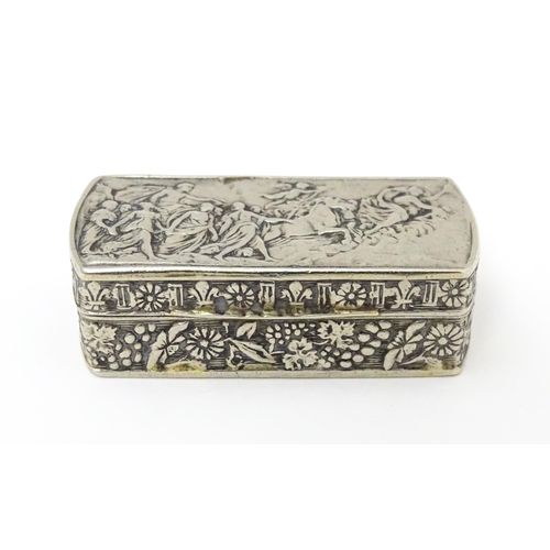 553 - An Italian white metal pill box of rectangular form with embossed decoration. Marked Italy under. Ap... 