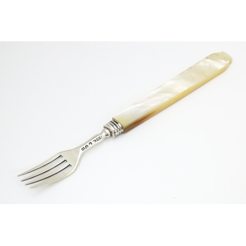 557 - A Victorian silver fork with mother of pearl handle. Hallmarked Birmingham 1844 maker John Hilliard.... 