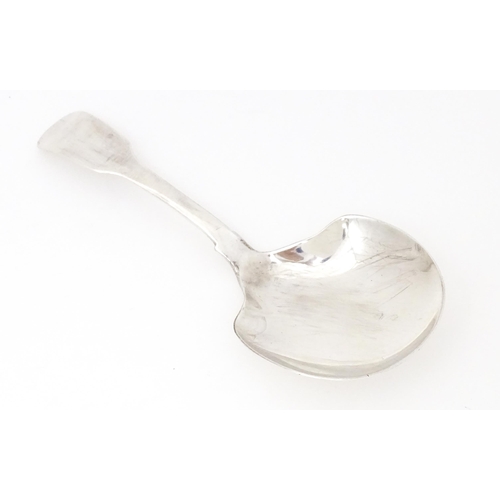 561 - A silver Fiddle pattern caddy spoon hallmarked London 1827 maker G.W. Approx. 4