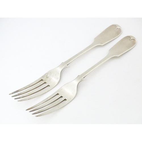 583 - A pair of Victorian silver Fiddle pattern table forks, hallmarked London 1892, maker Francis Higgins... 