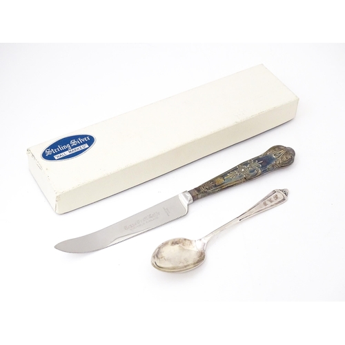 590 - A silver handled Grapefruit knife hallmarked Sheffield 1977 maker Harrison Brothers together with a ... 