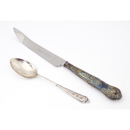 590 - A silver handled Grapefruit knife hallmarked Sheffield 1977 maker Harrison Brothers together with a ... 