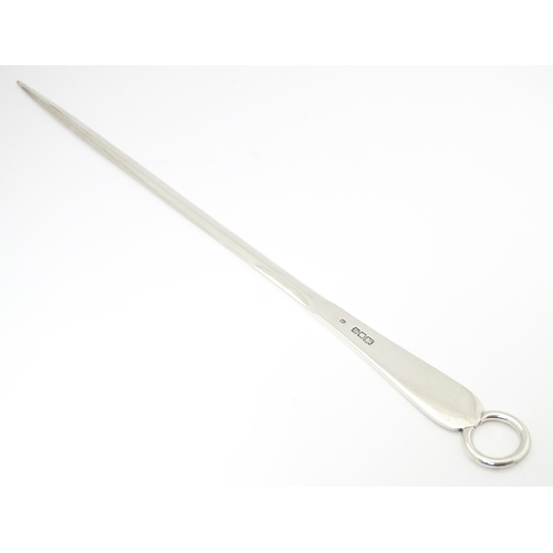 594 - A large silver meat skewer, hallmarked London 1916, maker Garrard & Co Ltd. Approx.15 1/