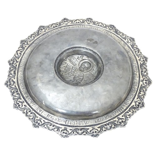 596 - A Greek Orthodox white metal ecclesiastical charger / paten / offertory plate depicting St Nicholas ... 