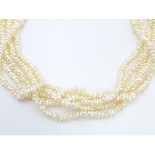 701 - Five various pearl necklaces, to include examples with silver clasps/ (5)