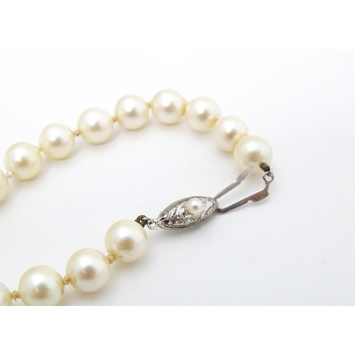 701 - Five various pearl necklaces, to include examples with silver clasps/ (5)