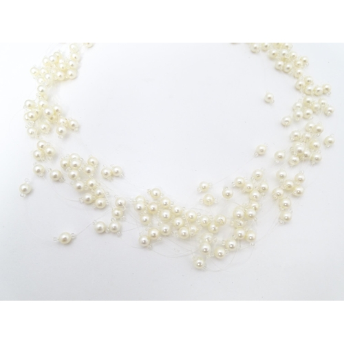 701 - Five various pearl necklaces, to include examples with silver clasps/ (5)